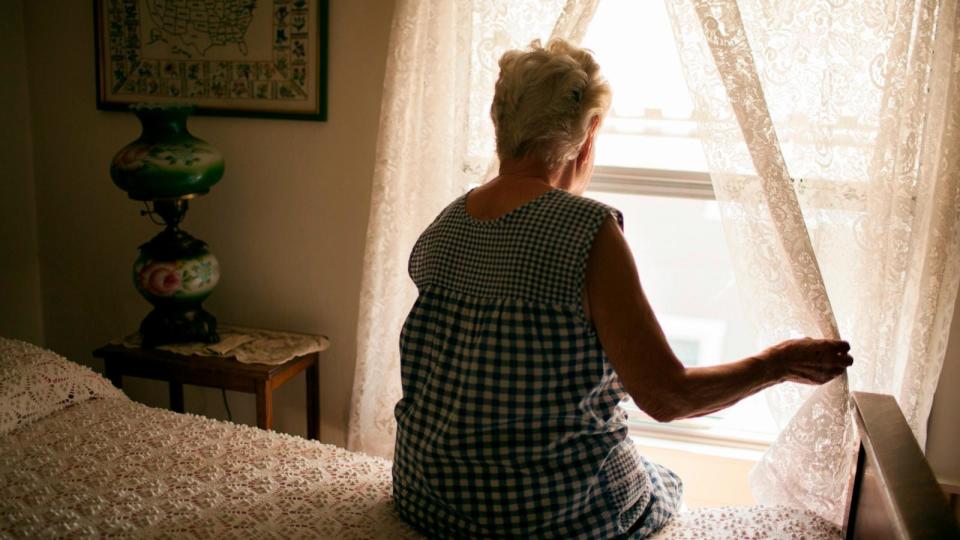PHOTO: Stock photo of a senior woman looking out the window. (STOCK PHOTO/Getty Images)