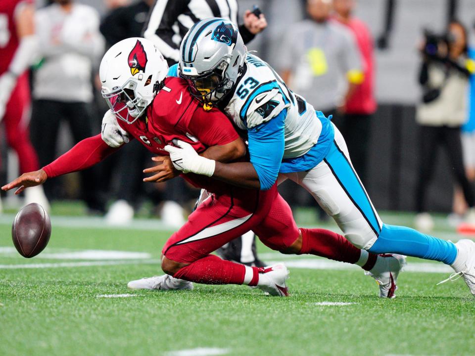 Brian Burns forces a fumble against the Arizona Cardinals.