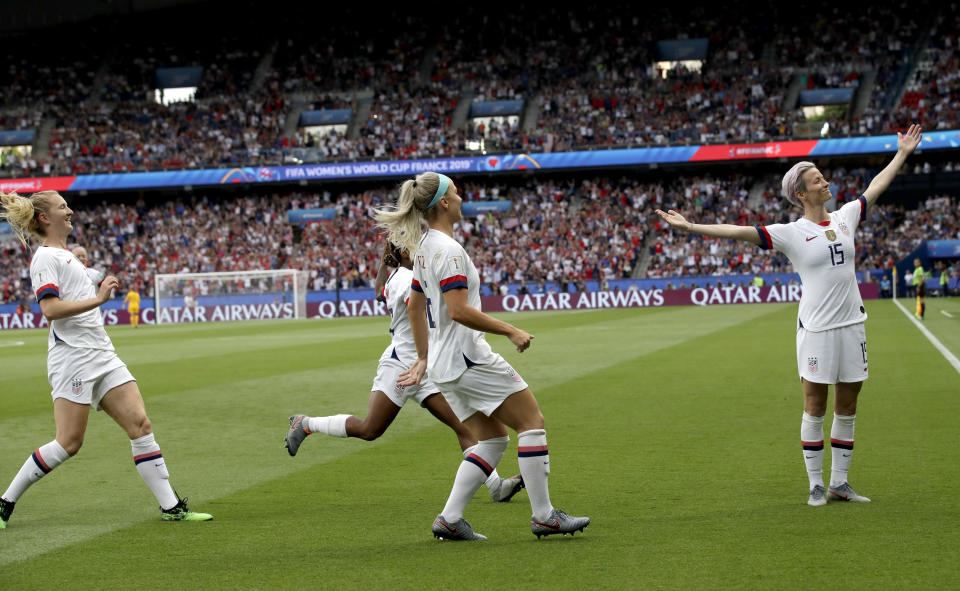 FILE - This June 28, 2019 file photo shows United States' Megan Rapinoe, right, celebrating after scoring her team's first goal during the Women's World Cup quarterfinal soccer match between France and the United States in Paris. (AP Photo/Alessandra Tarantino, File)