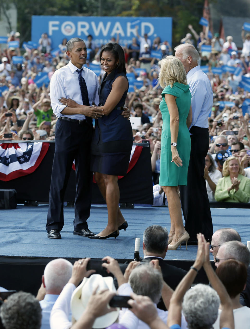 From left, President Barack Obama, first lady Michelle Obama, Jill Biden and Vice President Joe Biden, stand together on stage at a campaign event at Strawbery Banke Field, Friday, Sept. 7, 2012, in Portsmouth, N.H. (AP Photo/Carolyn Kaster)