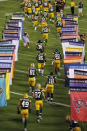 GREEN BAY, WI - SEPTEMBER 08: The Green Bay Packers run onto the field before taking on the New Orleans Saints in the season opening game at Lambeau Field on September 8, 2011 in Green Bay, Wisconsin. (Photo by Jonathan Daniel/Getty Images)