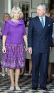 <p>In St. Lucia, as part of Charles and Camilla's Royal Tour of the Caribbean, Camilla donned this brilliant purple combo with a flowy, blousy top and a patterned skirt. </p>