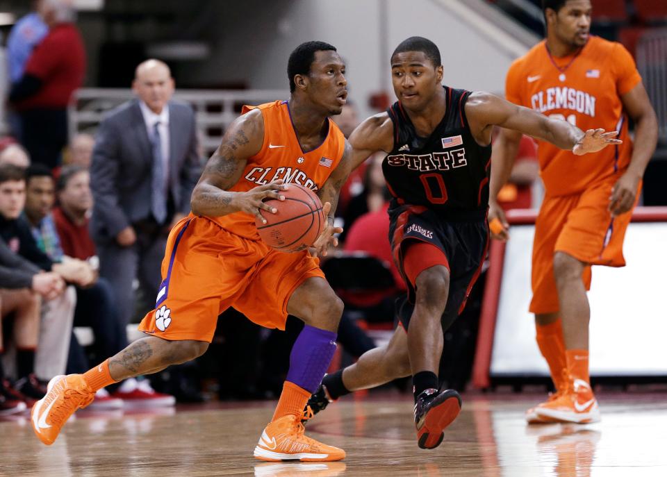 North Carolina State's Rodney Purvis (0) guards Clemson's Adonis Filer during the first half of an NCAA college basketball game in Raleigh, N.C., Sunday, Jan. 20, 2013.