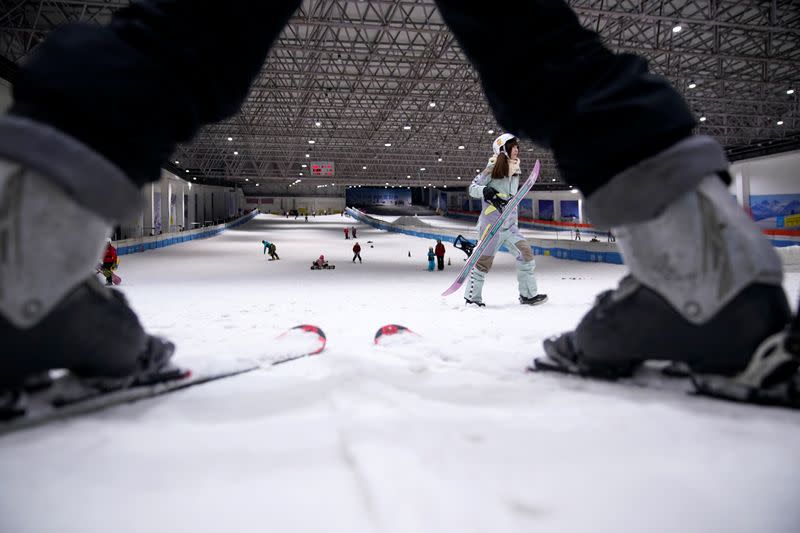 People visit an indoor ski park at Qiaobo Ice and Snow World in Shaoxing