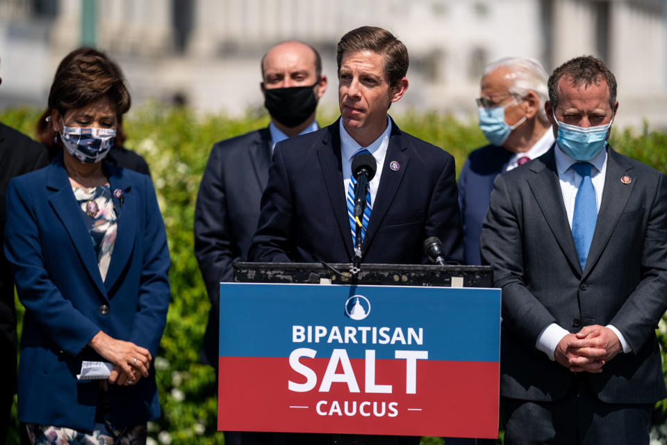 WASHINGTON, DC - APRIL 15: Rep. Mike Levin (D-CA), center, speaks while being flanked by Rep. Young Kim (R-CA) and Rep. Josh Gottheimer (D-NJ) at a news conference announcing the newly formed Bi-Partisan State and Local Taxes (SALT) Caucus outside the U.S. Capitol Building on Thursday, April 15, 2021 in Washington, DC.  (Kent Nishimura / Los Angeles Times via Getty Images)