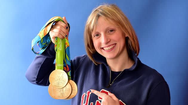 Ledecky shows off her medals. Pic: Getty