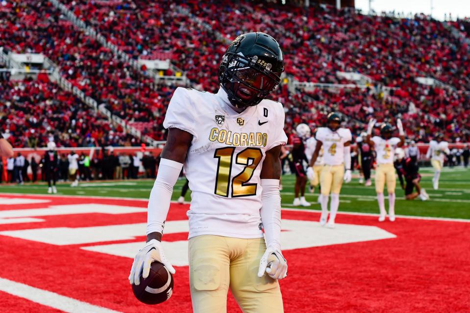 Nov 25, 2023; Salt Lake City, Utah, USA; Colorado Buffaloes athlete Travis Hunter (12) reacts after scoring a touchdown against the Utah Utes at Rice-Eccles Stadium.