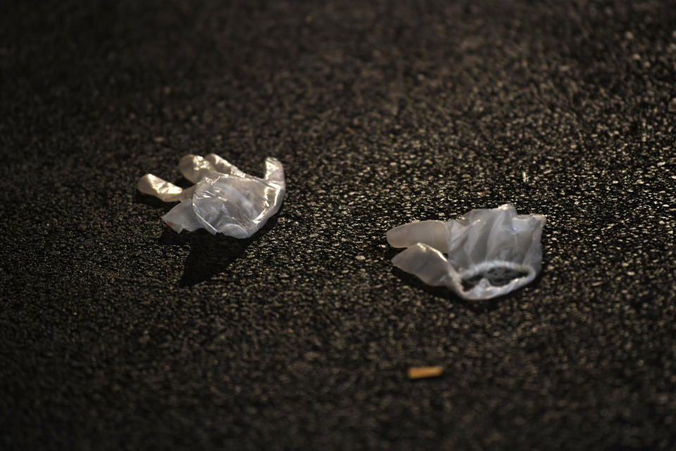 Gloves used by emergency services who helped the victims lie on the pavement after a deadly shooting took place in Strasbourg, France, early Dec.12, 2018. (Photo: Patrick Seeger/EPA-EFE/REX/Shutterstock)