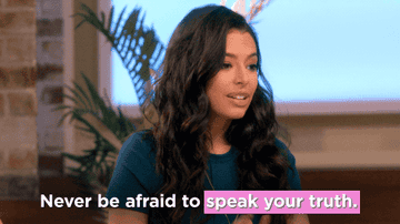 A woman saying "never be afraid to speak your truth"