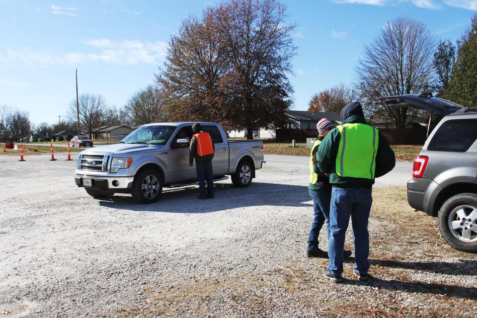 A driver is told where to go at a a mandatory CWD sampling station at Bolivar Fire Station No. 2 Nov. 13, 2022.