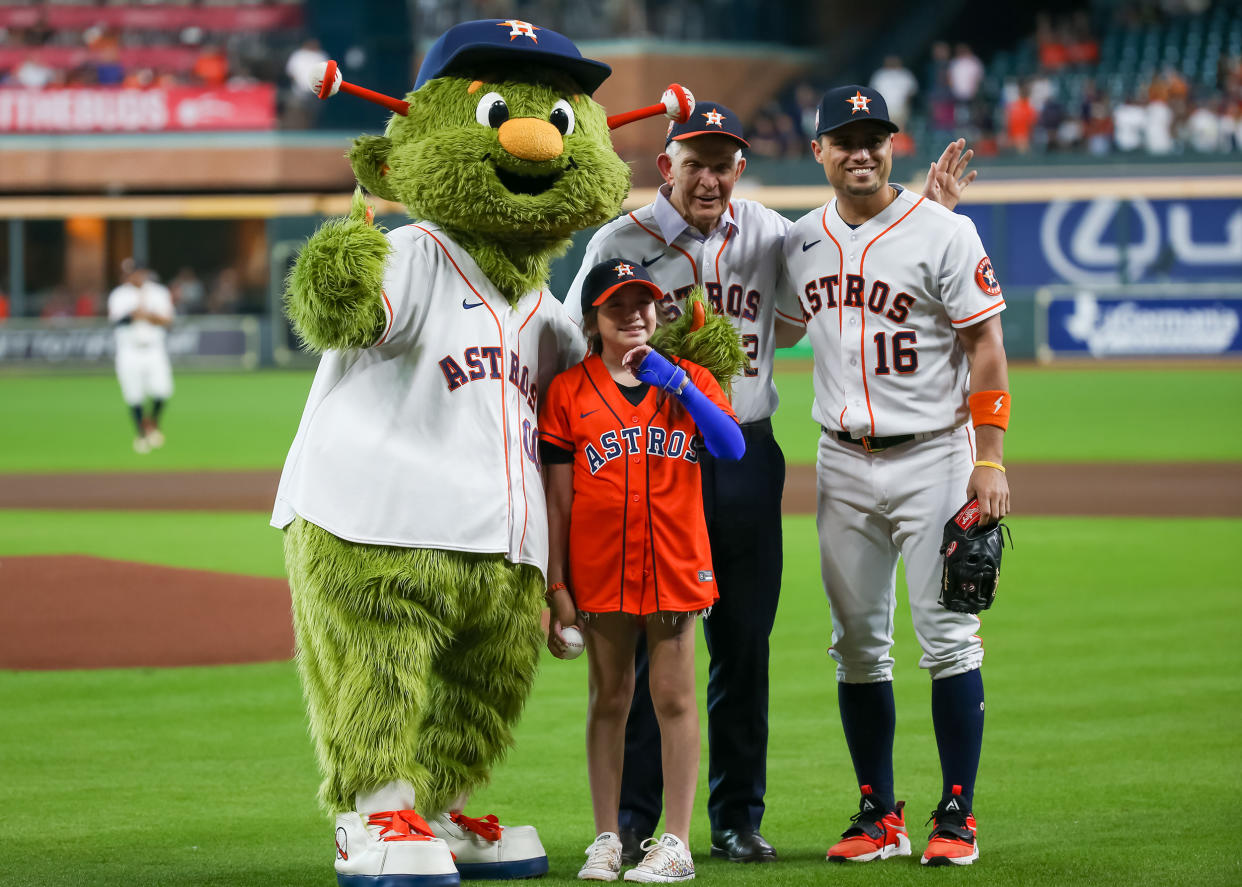 Houston Astros mascot Orbit, Uvalde mass shooting survivor Mayah Nicole Zamora, Gallery Furniture owner Jim Mattress Mac McVale and Houston Astros outfielder Aledmys Diaz pose during the MLB game between the Minnesota Twins and Houston Astros on Aug. 23, 2022 at Minute Maid Park in Houston, Texas. (Leslie Plaza Johnson / Icon Sportswire / Getty Images)