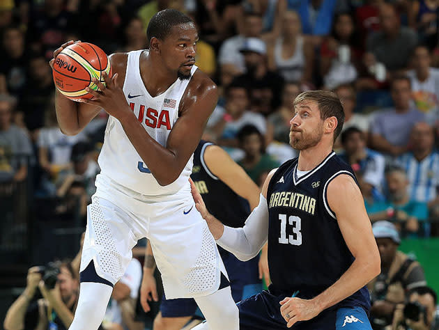 Kevin Durant triple-threats against Andres Nocioni. (Getty Images)