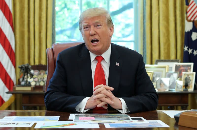 U.S. President Trump talks to reporters as he receives a Hurricane Dorian update at the White House in Washington