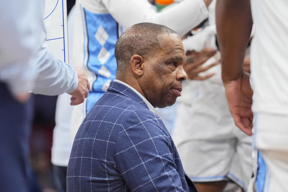 North Carolina head coach Hubert Davis speaking to his players during a time out in the second half of an NCAA college basketball game against North Carolina State in the championship of the Atlantic Coast Conference tournament, Saturday, March 16, 2024, in Washington. (AP Photo/Alex Brandon)