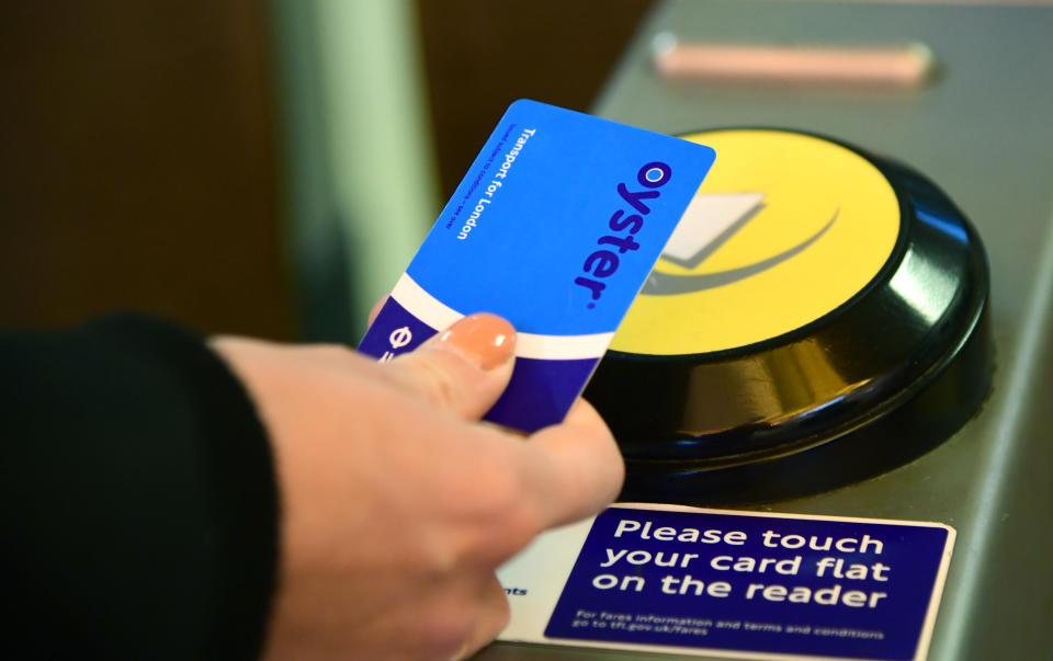 An Oyster card is used at a tube station in London. (Photo by Ian West/PA Images via Getty Images)