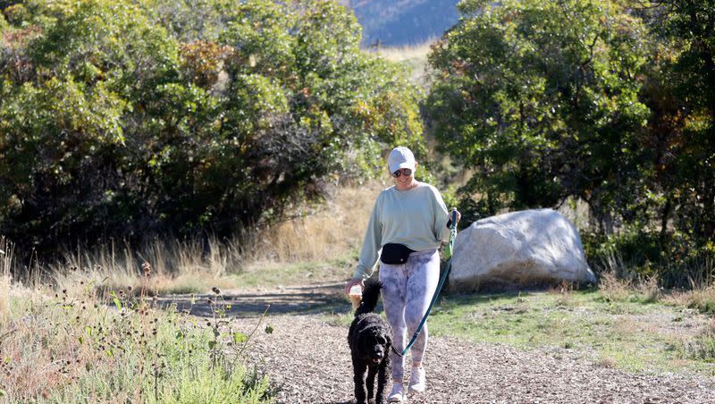 Elana Dawson walks with her dog Hank in Dimple Dell Regional Park in Sandy on Monday, Oct. 16, 2023.