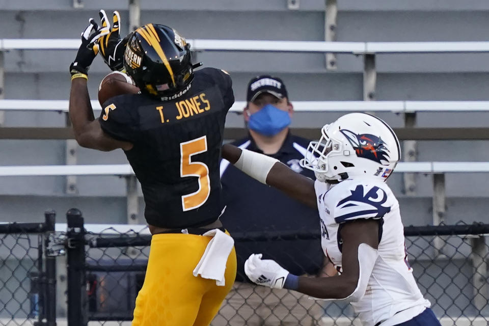 UTSA cornerback Ken Robinson, right, breaks up a pass to Southern Mississippi wide receiver Tim Jones (5) during the second half of an NCAA college football game, Saturday, Nov. 21, 2020, in Hattiesburg, Miss. UTSA won 23-20. (AP Photo/Rogelio V. Solis)