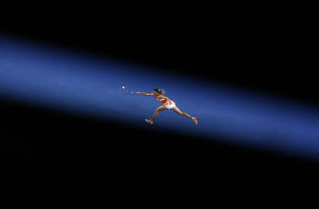 Russia's Maria Sharapova stretches to hit a shot during her third round match against Lauren Davis of the U.S. at the Australian Open tennis tournament at Melbourne Park, Australia, January 22, 2016. REUTERS/Jason Reed