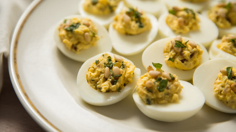 deviled eggs on white plate 