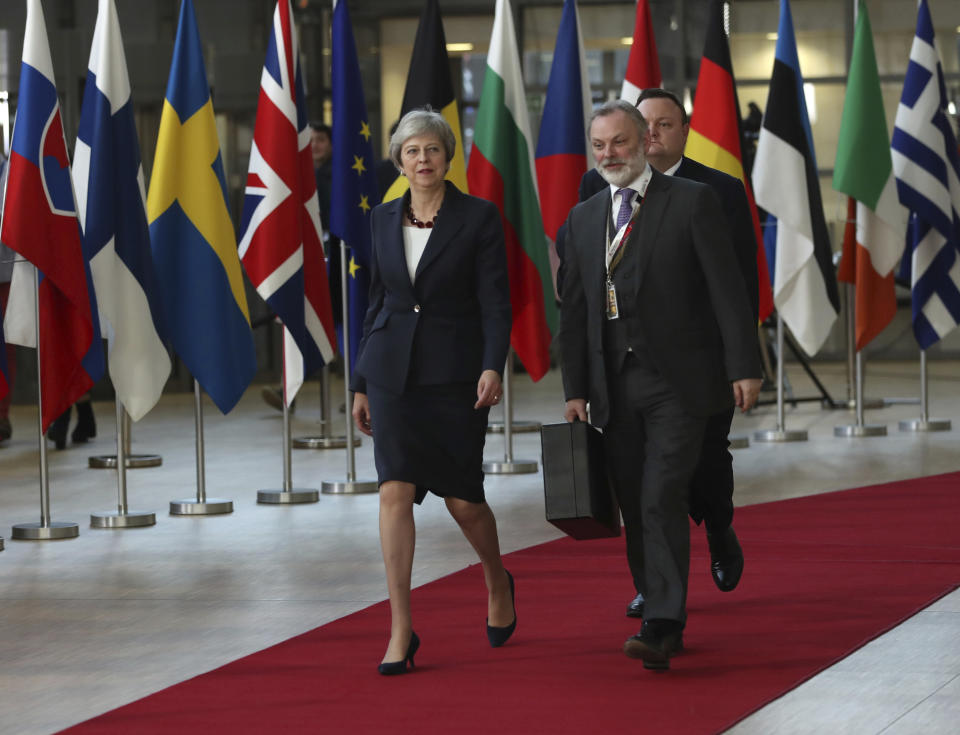 British Prime Minister Theresa May, left, arrives for an EU summit in Brussels, Wednesday, Oct. 17, 2018. European Union leaders are converging on Brussels for what had been billed as a "moment of truth" Brexit summit but which now holds little promise for a breakthrough. (AP Photo/Francisco Seco)