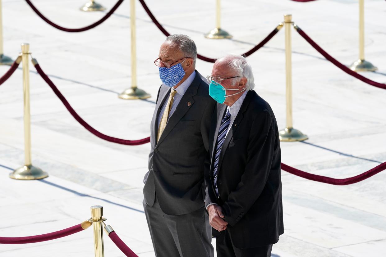 Sens. Chuck Schumer and Bernie Sanders pay their respects as the late Justice Ruth Bader Ginsburg lies in repose at the U.S. Supreme Court on Sept. 23, 2020. (AP Photo/Alex Brandon)