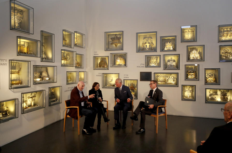 Britain's Prince Charles, second right, speaks with Holocaust survivor Marta Wise, second left, and George Shefi, left, whose mother perished at Auschwitz, during a reception at the Israel Museum in Jerusalem, Thursday, Jan. 23, 2020. (AP Photo/Frank Augstein, Pool)