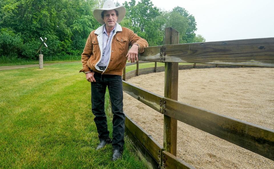 Mike Ewert stands next to a corral at his ranch, Cross Star, in Big Bend on June 13, 2023. Ewert started the nonprofit ranch in 2020 to help feed those in need. He and other volunteers raise steer and livestock to donate to Milwaukee-area food pantries and shelters. "The people that we are affecting are appreciative. I've seen it first hand," he said. "No matter what happens, this company will continue as long as I am able to physically and mentally support it."