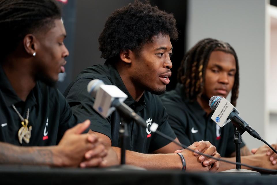 Bearcats new transfer defensive backs (left to right) Kye Stokes, Jared Bartlett and Derrick Canteen take questions during a press conference at the University of Cincinnati’s Fifth Third Arena in Cincinnati on Tuesday, Feb. 13, 2024.