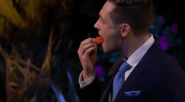 <p>ABC</p> Brendan chows down on a hot pepper on 'The Bachelorette'