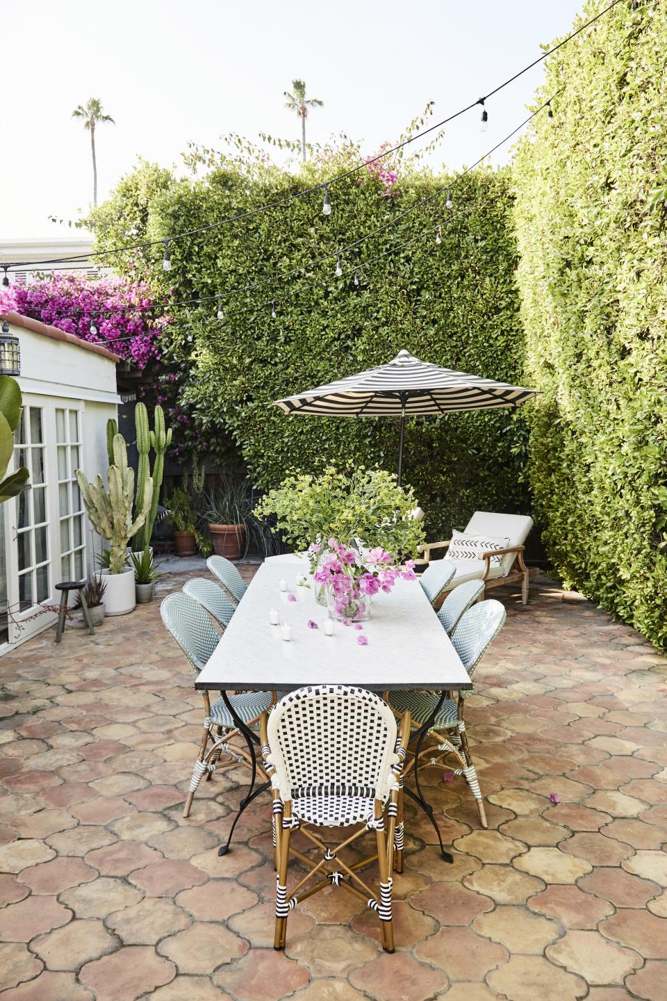 "The TV room kind of spills out into that bougainvillea wall. So it is kind of cool how you start the pink palette in the TV room and then all of a sudden you’re outside with that pop of fuchsia. I love it," says Spencer.