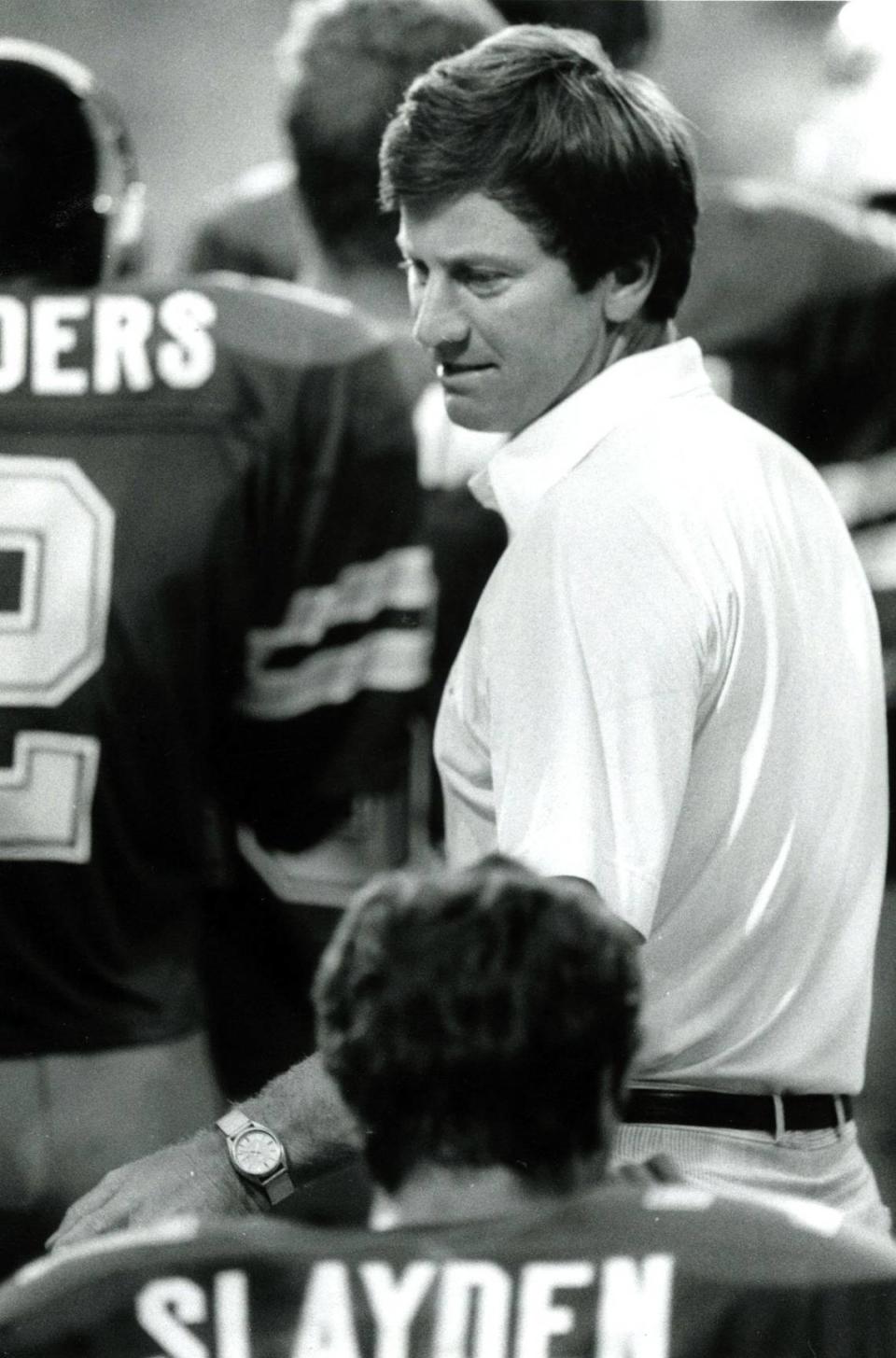 Duke coach Steve Spurrier talks with players on the sidelines during the Duke game against Colgate on Sept. 5, 1987. Spurrier coached the Blue Devils for three years, from 1987-89, winning an ACC championship in 1989 before leaving to take the job at the University of Florida, his alma mater.