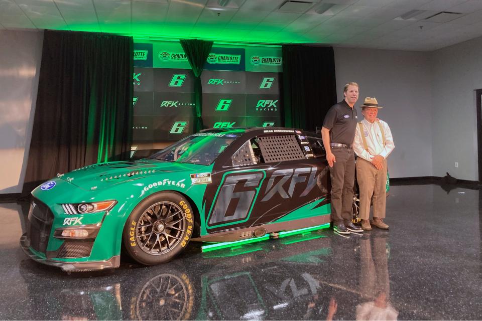 Keselowski (left) stands next to fellow team co-owner Jack Roush in front of the No. 6, displaying the name Roush Fenway Keselowski Racing in November of 2021. Keselowski made the move to co-ownership after finishing a successful 12-year run with Team Penske that year.