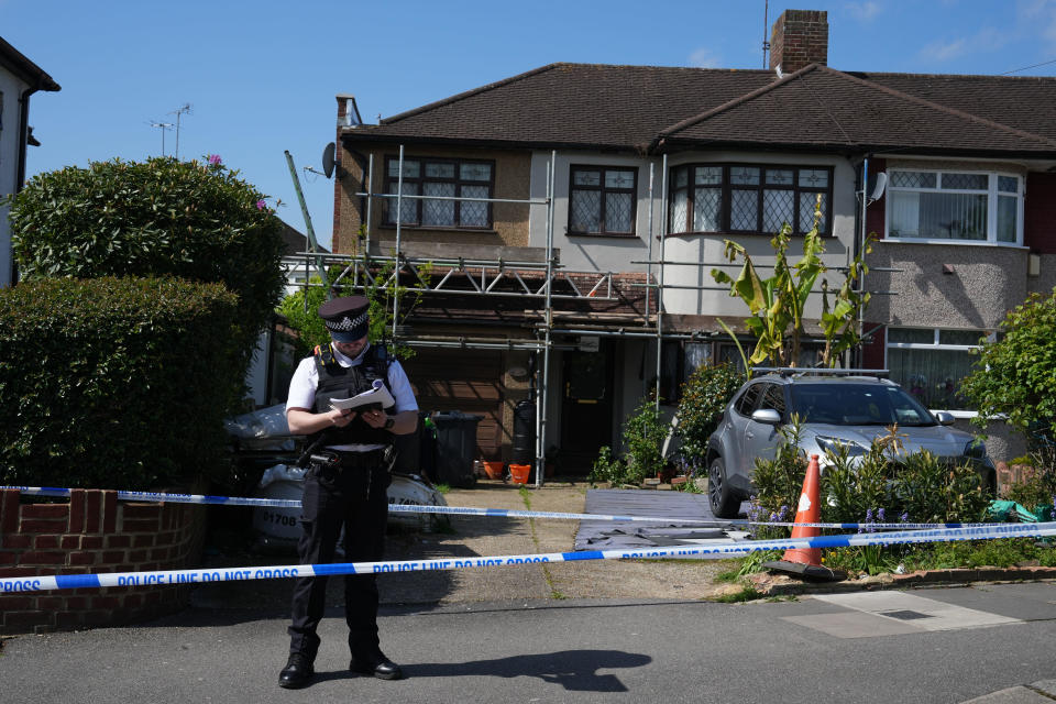 A police officer secures the scene after a sword attack, April 30, 2024 in Hainault, east London, in England. / Credit: Carl Court/Getty