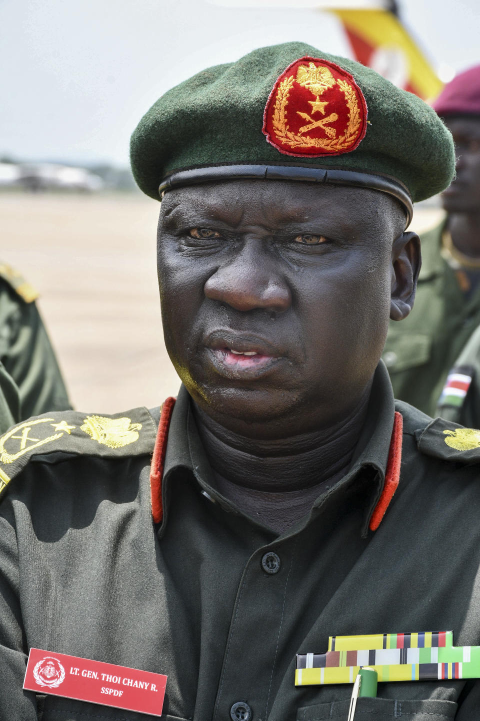 Deputy Chief of Defense Forces Lt. Gen. Thoi Chany Reat attends a ceremony for soldiers from the South Sudan People's Defence Forces (SSPDF) preparing to join the East Africa Community Regional Force (EACRF) in Congo, at the airport in Juba, South Sudan Monday, April 3, 2023. A United Nations-backed panel of investigators alleges in a new report that several officials in South Sudan including Reat have perpetrated serious human rights violations and should be held accountable for their crimes. (AP Photo/Samir Bol)