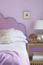 <p>Just a shade or two darker than the paint on the walls, the fabric-covered headboard really pops in this purple-on-purple space. </p><p><strong>RELATED: </strong><a href="https://www.goodhousekeeping.com/home/decorating-ideas/g770/decor-ideas-master-bedroom/" rel="nofollow noopener" target="_blank" data-ylk="slk:Brilliant Ways to Decorate a Master Bedroom;elm:context_link;itc:0;sec:content-canvas" class="link ">Brilliant Ways to Decorate a Master Bedroom </a></p>
