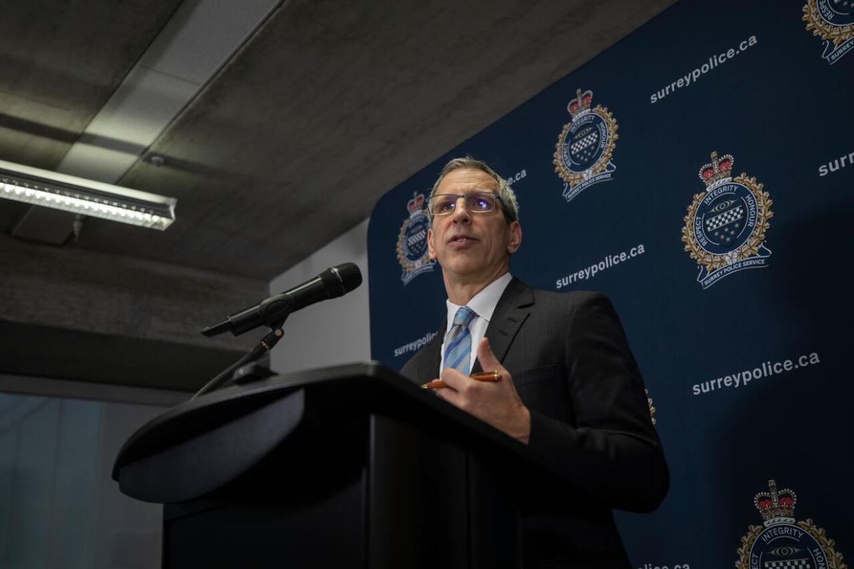 Surrey Police Board administrator Mike Serr announces the proposed Surrey Police Services budget for 2024 at a news conference in Surrey, B.C., on Thursday.  (Nav Rahi/CBC - image credit)