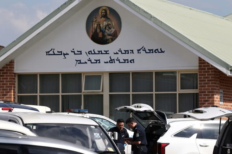 Forensic police and their vehicles can be seen outside the Christ the Good Shepherd Church in Sydney (DAVID GRAY)