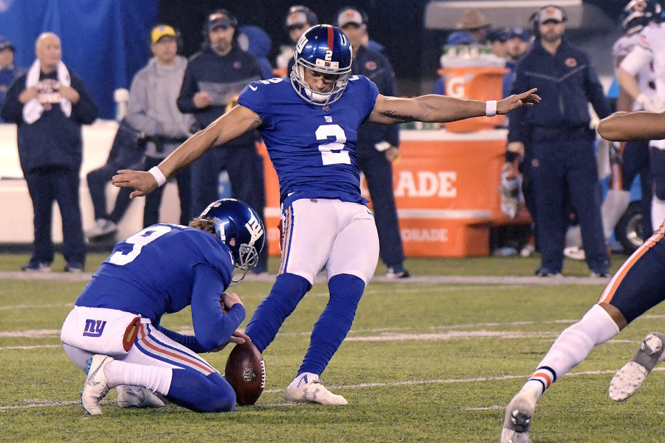 New York Giants kicker Aldrick Rosas (2), with Riley Dixon holding, kicks a field goal during overtime of an NFL football game against the Chicago Bears, Sunday, Dec. 2, 2018, in East Rutherford, N.J. The Giants won 30-27 in overtime. (AP Photo/Bill Kostroun)