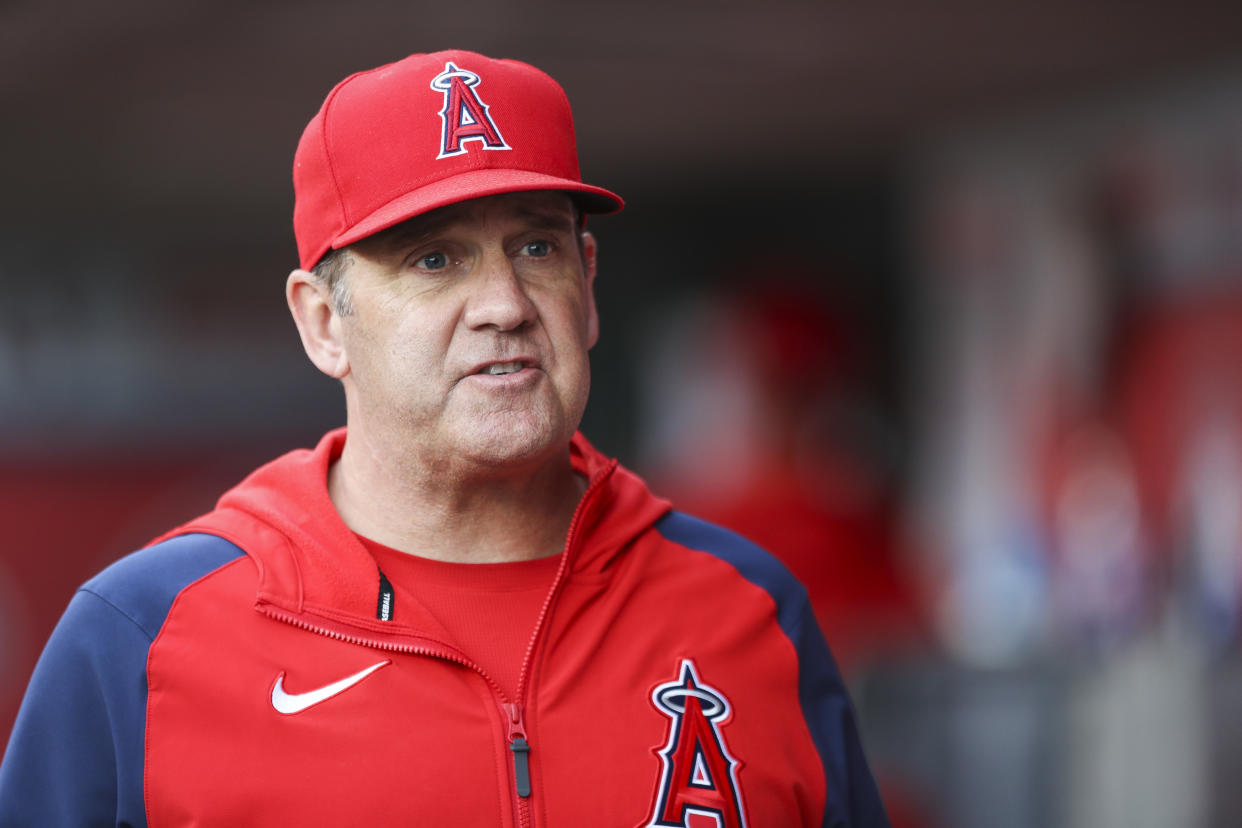 ANAHEIM, CALIFORNIA - MAY 27: Catching coach Bill Haselman #82 of the Los Angeles Angels walks through the dugout ahead of the game against the Toronto Blue Jays at Angel Stadium of Anaheim on May 27, 2022 in Anaheim, California. (Photo by Meg Oliphant/Getty Images)