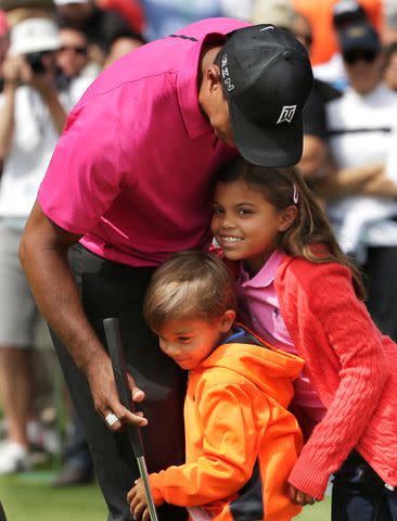 Chris Carlson/AP Tiger Woods, Sam Woods and Charlie Woods in 2015