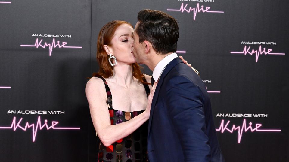 The pair kissing on red carpet