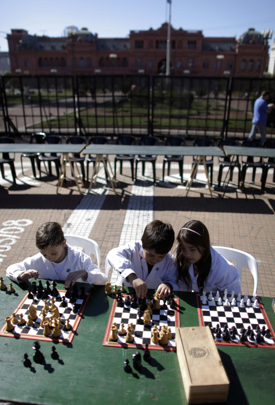 FILE - This April 15, 2009 file photo shows students playing chess at Plaza de Mayo during the Argentina's School Chess Day in Buenos Aires. (AP Photo/Natacha Pisarenko, file)