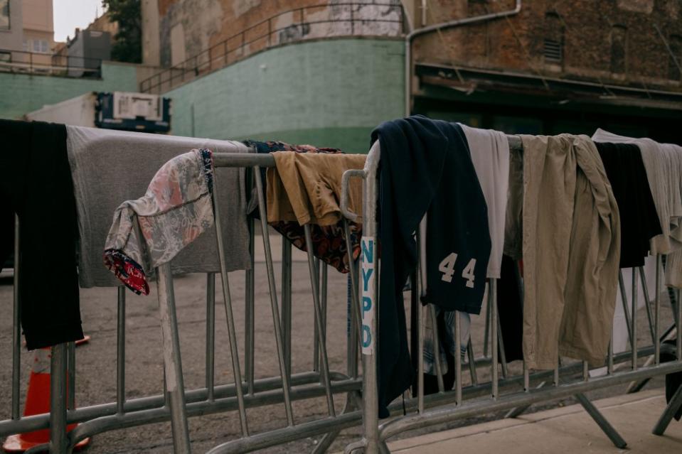 Various articles of clothing belonging to asylum seekers, that have been washed inside the 47 Hall Street facility's mobile shower units, are hung to dry in the Brooklyn borough of New York City, on July 19.<span class="copyright">José A. Alvarado Jr. </span>