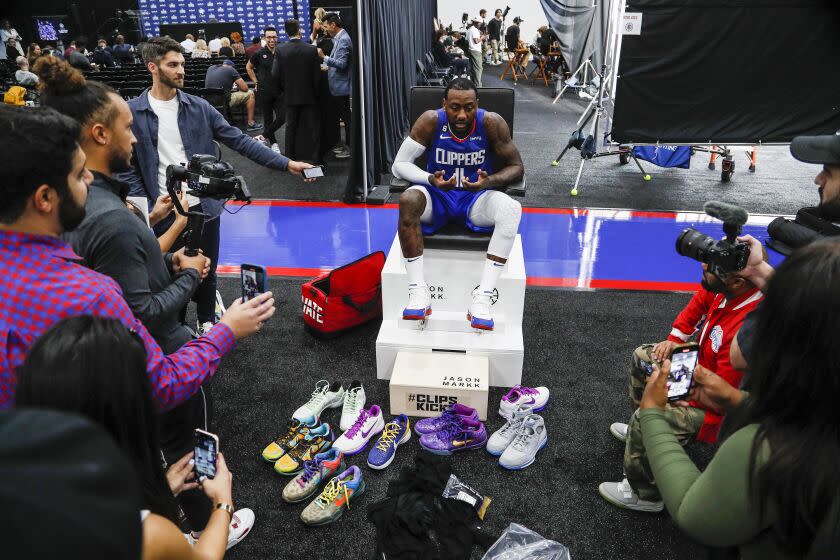 Los Angeles, CA, Monday, September 26, 2022 - John Wall talks with reporters.