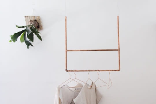 <p><b>For the bedroom:</b></p><p><b>Think outside the box.</b> Use storage solutions that can do double duty: a single-level bookcase that doubles as a bench, a butcher block installed with shelves for appliance storage, a mirror that opens to reveal secret shelves, or Madelynn Furlong’s copper pipes that come together as a hanging rack. They’re as easy to make as they look: Just thread a thick cotton rope through pipes and fasten them overhead to a ceiling hook. <i>(Photo: Madelynn Hackwith Furlong/Food52)</i><b><br>Related: <a href="https://food52.com/blog/14336-design-trends-that-actually-work-for-your-real-life-kitchen?utm_source=yahoomakers&utm_medium=referral&utm_campaign=spacesavingsolutionsforeveryroominyourhouse" rel="nofollow noopener" target="_blank" data-ylk="slk:Design Trends That Actually Work For Your Real Life Kitchen;elm:context_link;itc:0;sec:content-canvas" class="link "><i>Design Trends That Actually Work For Your Real Life Kitchen</i></a></b></p>