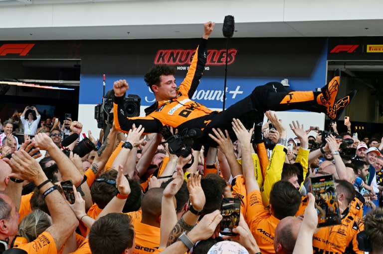 McLaren's Lando Norris is tossed in the air as his team celebrates victory at the Miami Grand Prix on Sunday (Giorgio Viera)