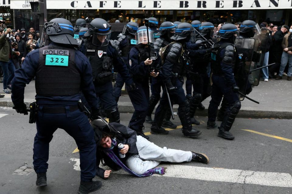 French CRS riot police apprehend a protester amid clashes during a demonstration in Paris (REUTERS)