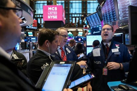 Traders work on the floor of the New York Stock Exchange (NYSE) in New York, U.S., December 14, 2018. REUTERS/Brendan McDermid