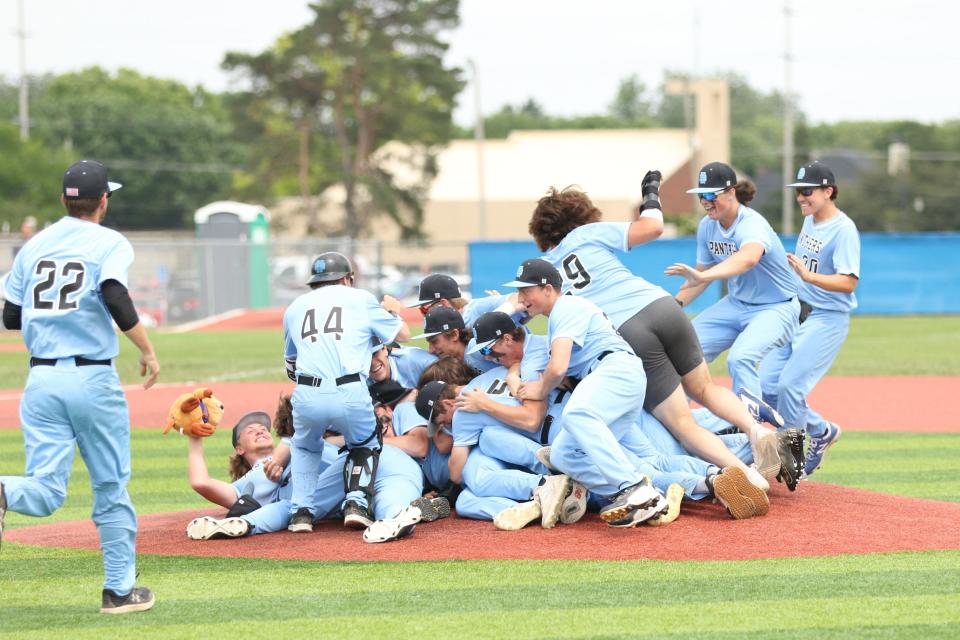Hilliard Darby celebrates its 6-1 win over Olentangy Liberty in a Division I district final May 28 at Grove City. The game started May 26 and was suspended because of rain, then postponed the following day.