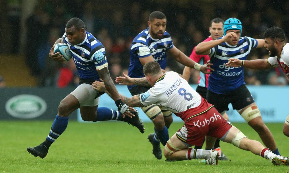 Bath’s Semesa Rokoduguni breaks past Northampton’s Teimana Harrison as wind and rain made for a slippery encounter at the Rec.